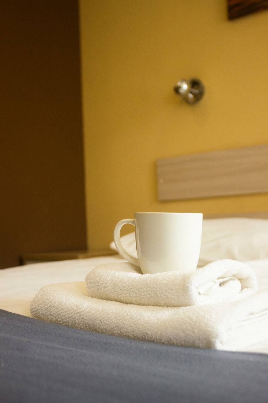 Фотографии номера Эконом с двуспальной кроватью с ванной комнатой на этаже в Гостинице Багет Нижний Новгород