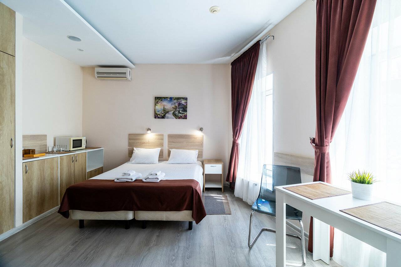 Фотографии номера Эконом с двуспальной кроватью с ванной комнатой на этаже в Гостинице Багет Нижний Новгород